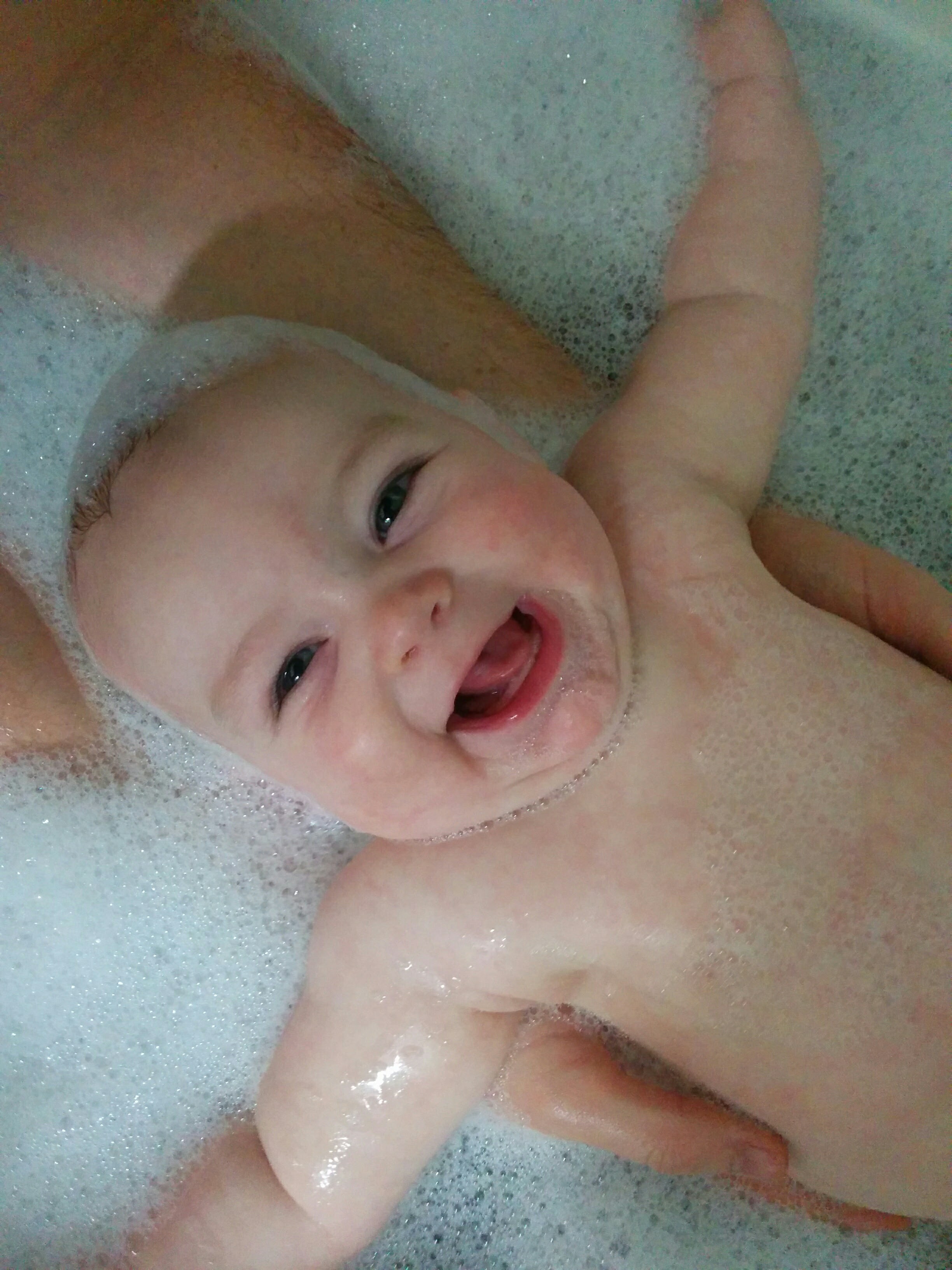 Happy baby in bubbles