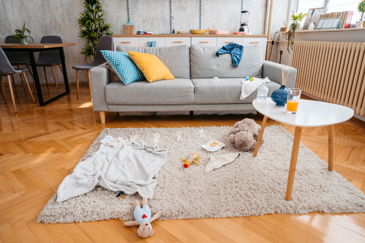 Living room with some baby toys and blankets on the floor